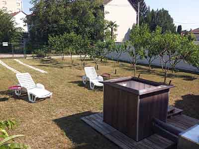 Private hot tub relaxation area in a garden retreat in Subotica
